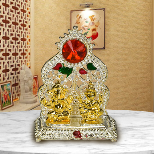 Silver Plated mandap with Golden Ganesh Laxmi Idol Silver Plated mandap with Golden Ganesh Laxmi Idol