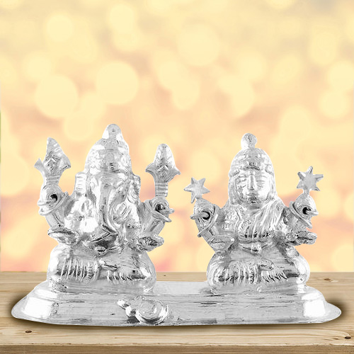 Divine looking silver plated Laxmi Ganesh idol Divine looking silver plated Laxmi Ganesh idol