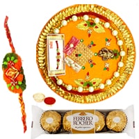 Relishing Ferreo Rocher Chocolates and a special Pooja Thali with a Free Rakhi, Roli Tilak and Chawal Relishing Ferreo Rocher Chocolates and a special Pooja Thali with a Free Rakhi, Roli Tilak and Chawal