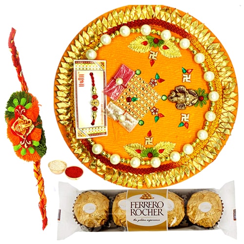 Relishing Ferreo Rocher Chocolates and a special Pooja Thali with a Free Rakhi, Roli Tilak and Chawal Relishing Ferreo Rocher Chocolates and a special Pooja Thali with a Free Rakhi, Roli Tilak and Chawal