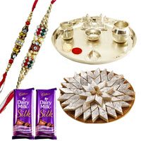 An Exclusive Gift Hamper with Silver Plated Thali, Delicious Kaju Katli and Gift Voucher from Raymond along with 2 free Rakhi,Roli Tika and Chawal An Exclusive Gift Hamper with Silver Plated Thali, Delicious Kaju Katli and Gift Voucher from Raymond along with 2 free Rakhi,Roli Tika and Chawal