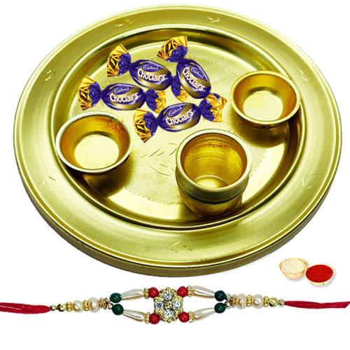 Fabulous Gift of 4 Choco Eclairs placed in a Adorable Silver Plated Thali Fabulous Gift of 4 Choco Eclairs placed in a Adorable Silver Plated Thali