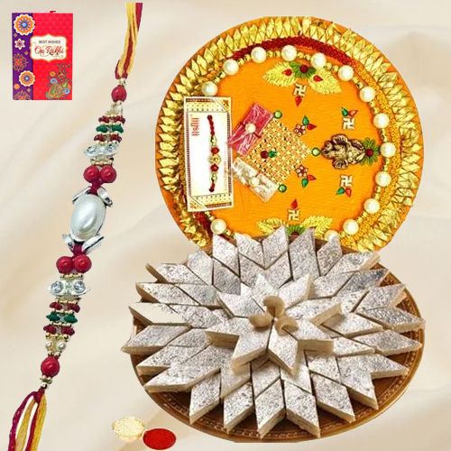 Delicious Kaju Katli and Designer Pooja Thali along Rakhi, Roli, Tilak and Chawal Delicious Kaju Katli and Designer Pooja Thali along Rakhi, Roli, Tilak and Chawal