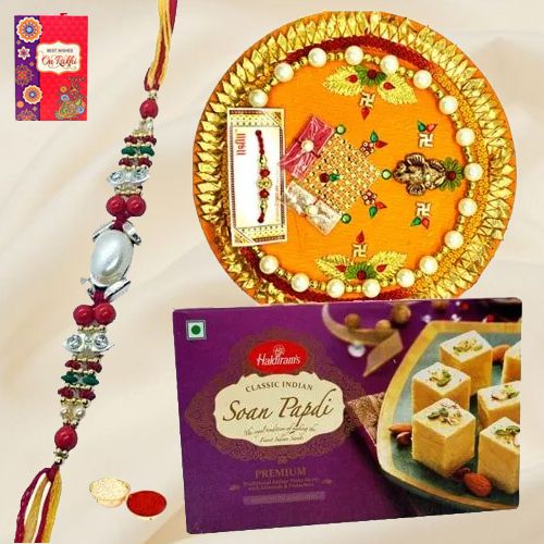 Soan Papri and Designer Pooja Thali along Rakhi, Roli, Tilak and Chawal Soan Papri and Designer Pooja Thali along Rakhi, Roli, Tilak and Chawal