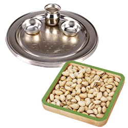 Outstanding Composition of Silver Thali and Roasted Pistachio for Diwali Celebration Outstanding Composition of Silver Thali and Roasted Pistachio for Diwali Celebration