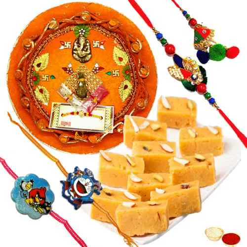 Charming Gift of Mysore Pak, 1 Bhaiya Bhabhi Rakhi, 2 Kids Rakhi and 1 Rakhi Thali