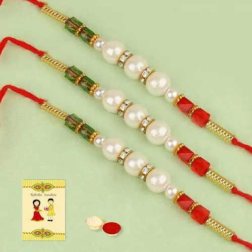 Exquisite Set of 3 Pearl Rakhis with Roli, Chawal n Card Exquisite Set of 3 Pearl Rakhis with Roli, Chawal n Card