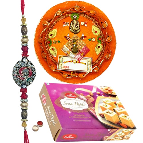 Auspicious Thali with Rakhi and Soan Papdi 250 Gms. from Haldirams Auspicious Thali with Rakhi and Soan Papdi 250 Gms. from Haldirams