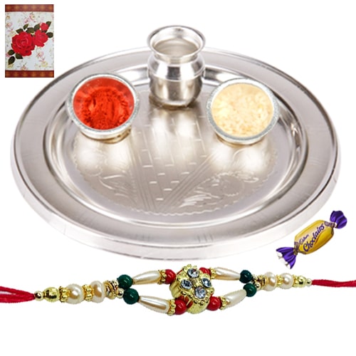 Stunning Silver Thali with Choco Delight and Rakhi Stunning Silver Thali with Choco Delight and Rakhi