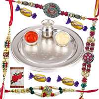Impressive Two Pairs of Rakhi and Chocolates with a Silver Plated Rakhi Thali Impressive Two Pairs of Rakhi and Chocolates with a Silver Plated Rakhi Thali