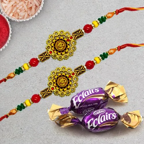 Gorgeous Pair of Om Rakhi with Chocolates, Roli Chawal Tika n Card Gorgeous Pair of Om Rakhi with Chocolates, Roli Chawal Tika n Card
