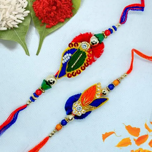 Delightful Zardosi Rakhi Pair with Roli, Chawal n Card Delightful Zardosi Rakhi Pair with Roli, Chawal n Card