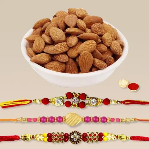 Charming Set of 3 Rakhis with Crunchy Almonds, Roli Tika n Card Charming Set of 3 Rakhis with Crunchy Almonds, Roli Tika n Card