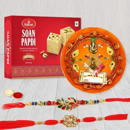 Elegant Pair of Rakhi with Puja Thali N Haldiram Soan Papadi Elegant Pair of Rakhi with Puja Thali N Haldiram Soan Papadi